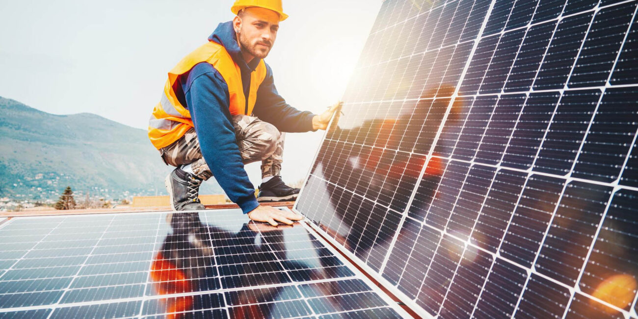 workers-assemble-energy-system-with-solar-panel-electricity